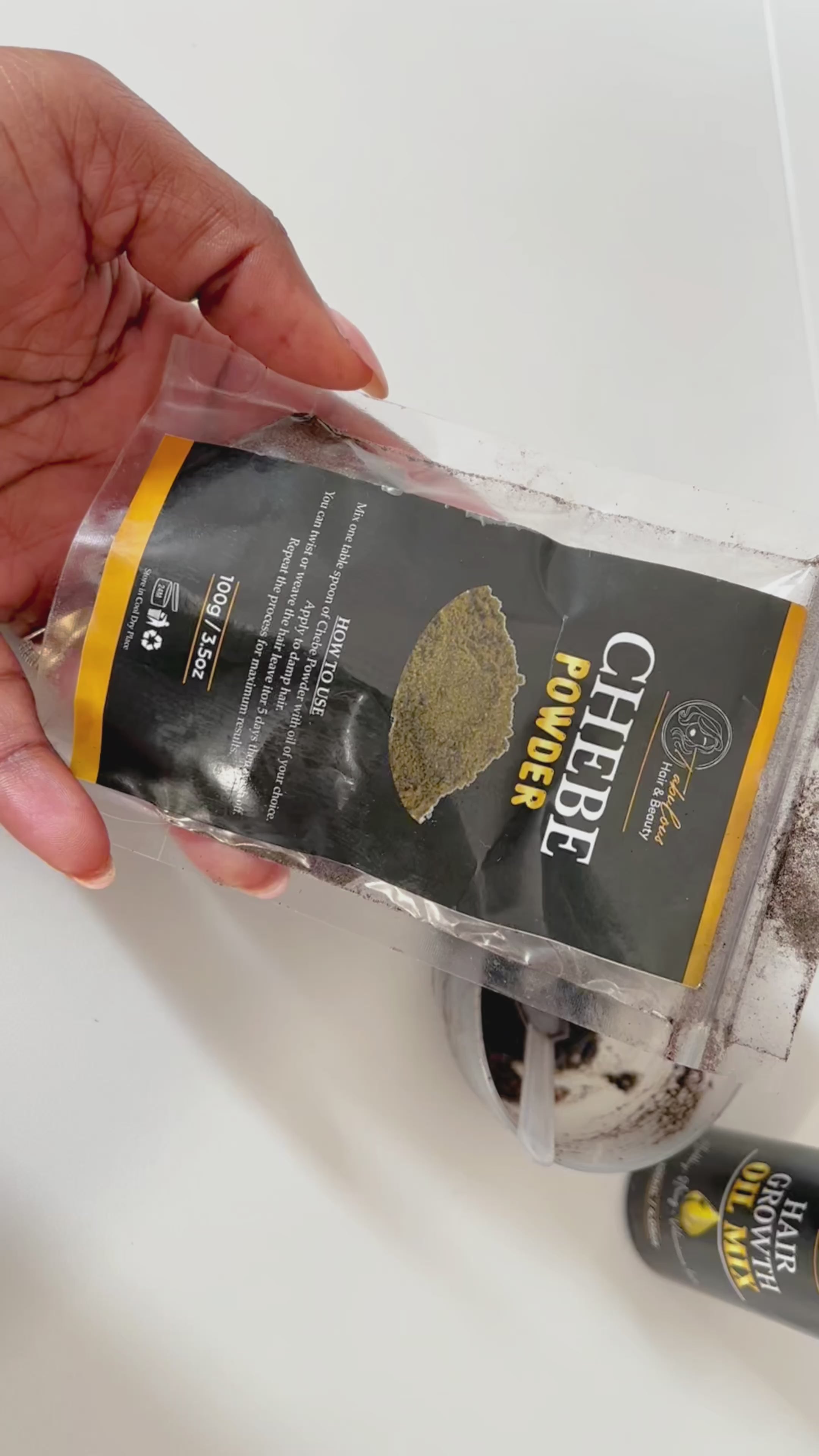 Load video: video showing on to mix chebe powder to apply on hair for hair retention